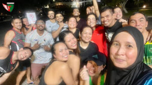 Desert Falcons Dragon Boat team in action during their evening water training session at QD's - Deira Creek, guided by Coach Alain. The team, including both experienced paddlers and enthusiastic newbies, pushes through synchronized strokes, building strength and coordination for upcoming races.